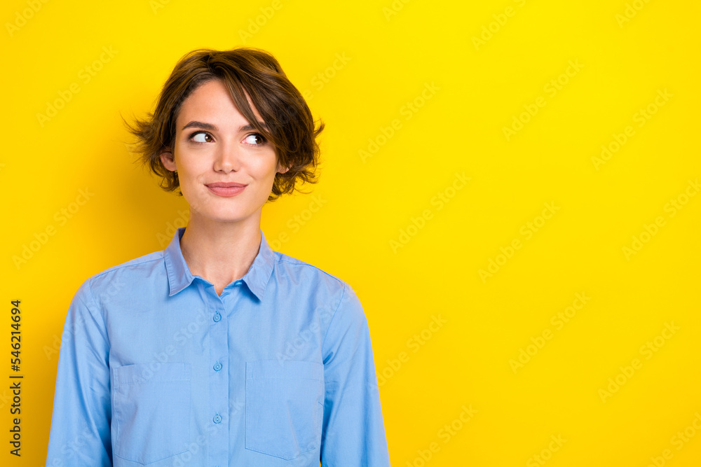 Closeup photo of young positive businesswoman wear formal blue shirt leader boss dreamy interested look empty space ad isolated on yellow color background Closeup photo of young positive businesswoman wear formal blue shirt leader boss dreamy interested look empty space ad isolated on yellow color background