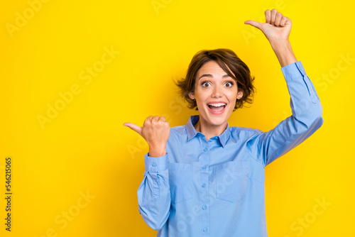 Bilde på lerret Portrait photo of young funny excited girlish woman wear blue shirt crazy finger