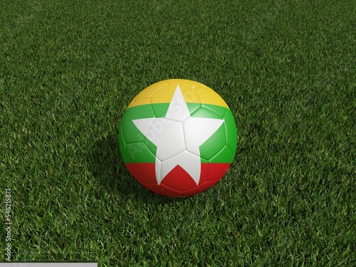 Football in Myanmar flag on green grass. 3d rendering