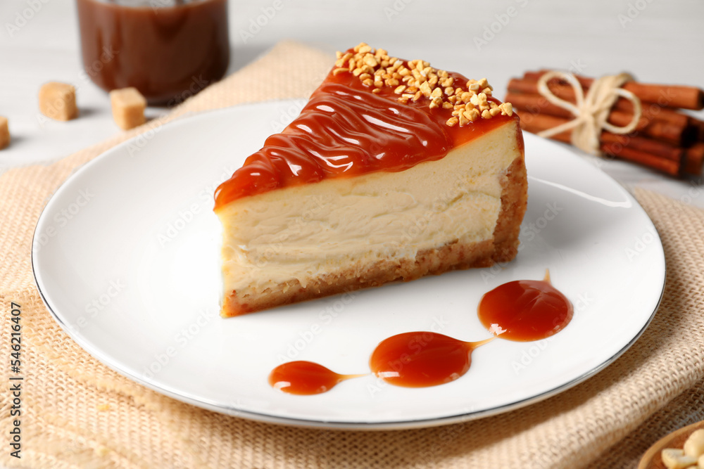 Tasty cheesecake with caramel and nuts served on table Tasty cheesecake with caramel and nuts served on table