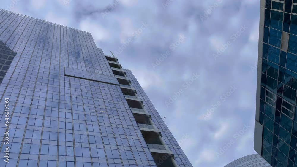 Office building windows on skyscraper building with many corporate offices of success companies. Real estate for rent and commercial using. Time lapse Office building windows on skyscraper building with many corporate offices of success companies. Real estate for rent and commercial using. Time lapse