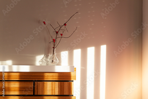 Bedroom with Zebrano wood headboard, with the sun coming through the window.