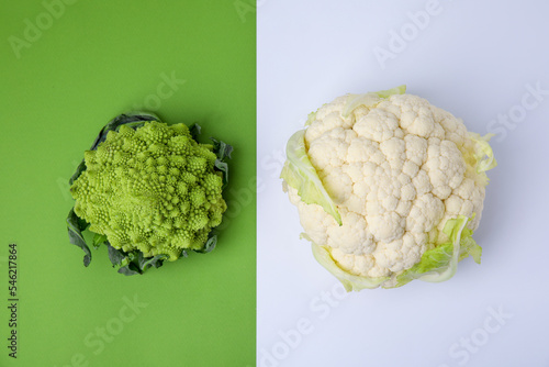 Fresh Romanesco broccoli and cauliflower on colorful background, flat lay