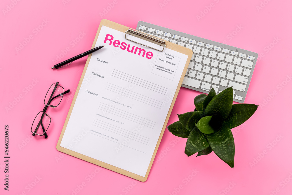 Resume application form on office table. Find new job concept Resume application form on office table. Find new job concept
