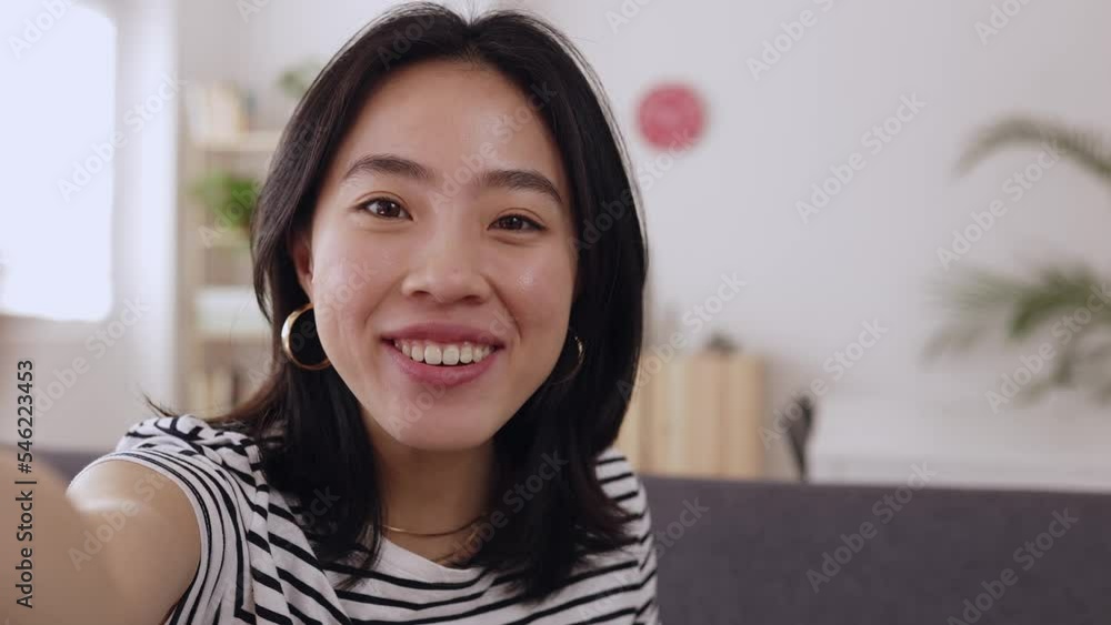 POV happy young teenage asian girl having a video call through smartphone network app at home. Cheerful chinese female talking on videoconference by cellphone - High quality 4k footage POV happy young teenage asian girl having a video call through smartphone network app at home. Cheerful chinese female talking on videoconference by cellphone - High quality 4k footage