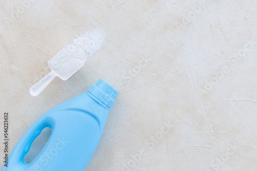 Washing powder with measuring scoop and laundry conditioner bottle