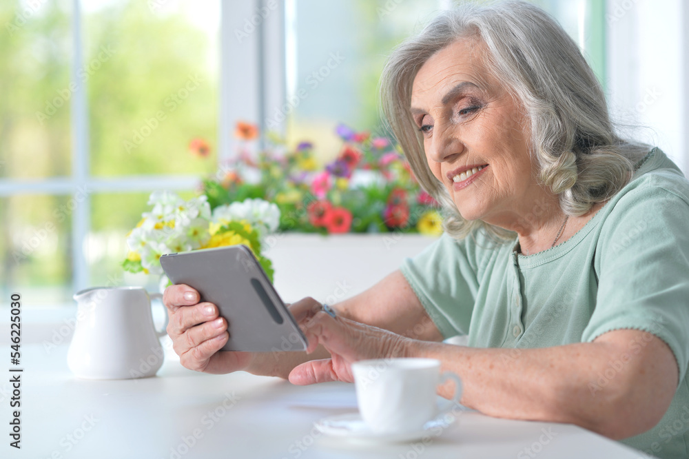 Woman using modern tablet Woman using modern tablet