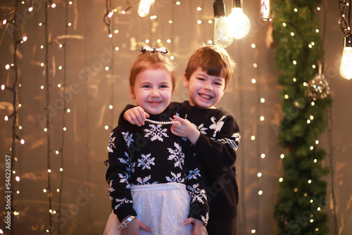 A young family with children decorates the house for the holiday. New Years Eve. Waiting for the new year.