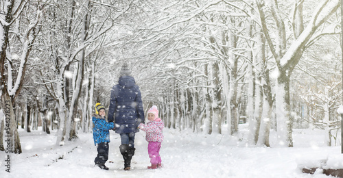 Winter park under the snow. A snowstorm in the city park. Park for walks with the whole family under the snow cover.