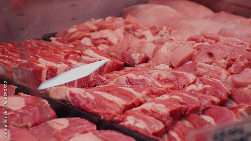 Raw pork uncooked meat organic food for barbecue in shop. Most commonly consumed meat worldwide. Food industry. Raw pork uncooked meat organic food for barbecue in shop. Most commonly consumed meat worldwide. Food industry.