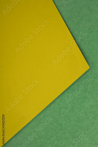 Abstract vertical triangular coloured papers on white background looks like side view of an open book plain vs textured cover