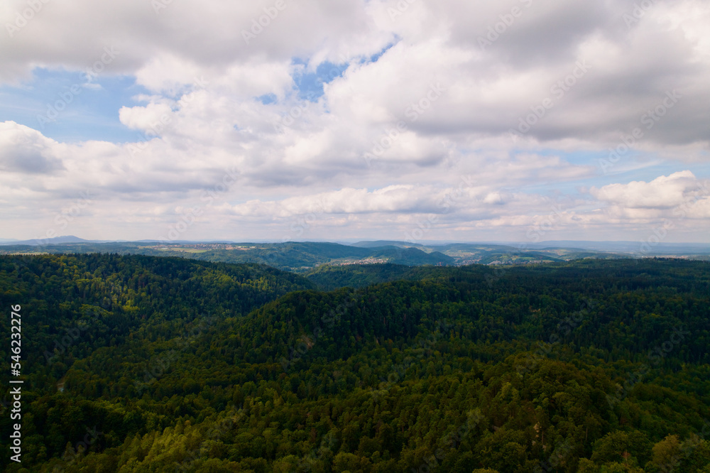 Naklejka premium Aerial view of woodland seen from medieval village Kyburg on a cloudy late summer day. Photo taken September 1st, 2022, Kyburg, Switzerland.