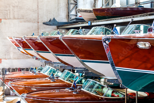 Classic wooden motor boats in shipyard