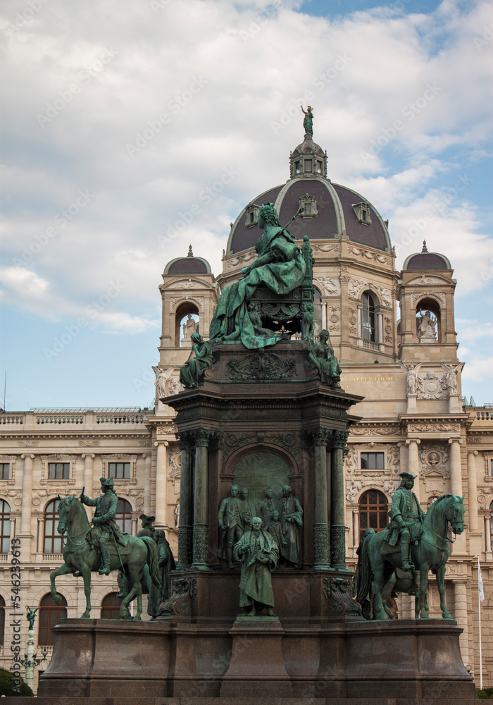 Facade of the Natural History Museum and statues of Empress Maria Theresa (ruler of the Habsburg dominions) monument in the old town of Vienna, Austria, Central Europe. Ancient bronze statue closeup. 