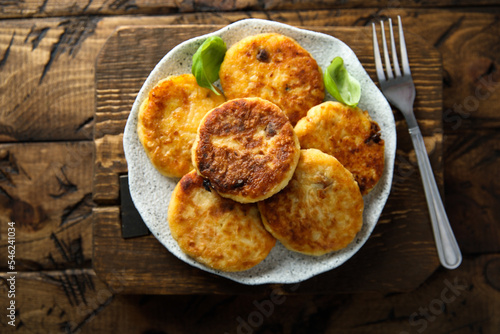 Homemade savory potato pancakes with fresh basil