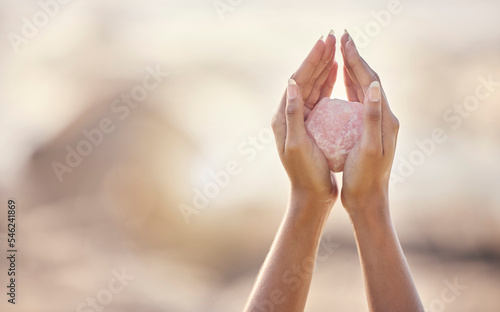 Woman, crystal hands and zen outdoor in nature for healing wellness, mindfulness or peace with spirit rock. Rose quartz, energy stone or calm spiritual meditation for growth, health or relax for girl photo