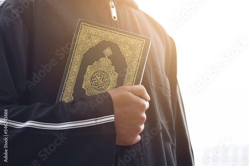 Muslim man reading holy quran. islamic concept