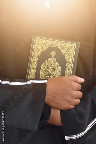 Fototapeta Muslim man reading holy quran. islamic concept
