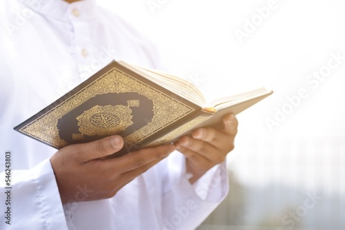 Muslim man reading holy quran. islamic concept