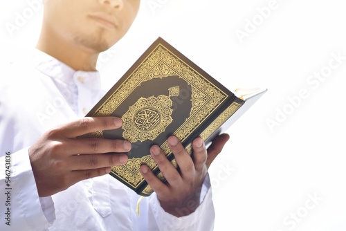 Muslim man reading holy quran. islamic concept