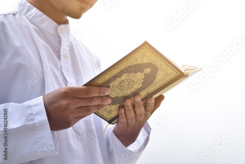 Muslim man reading holy quran. islamic concept