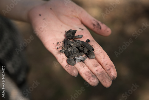 Coal on a woman's hand
