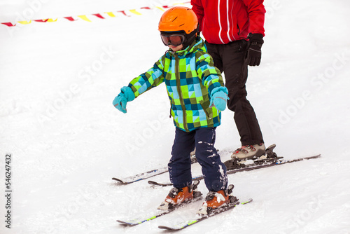 Ski Instructor Learning to ski Little Child Kid. Ski School. Winter Ski Holidays.