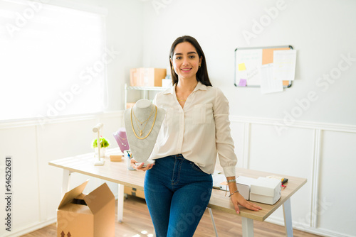 Beautiful woman working from home selling jewelry on the internet