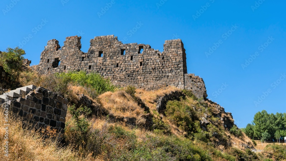 Armenia, Amberd, September 2022. The ruins of the walls of an ancient fortress on the mountain.