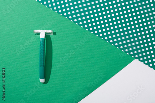 top view green disposable razor photo