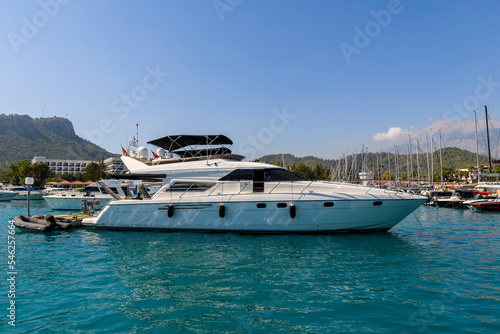 Super luxury Yacht moored in marina. Sunny weather. View from sea. Yachting, cruising, vacations, recreation concept. © Alexey Seafarer