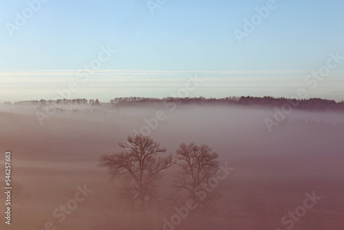 foggy morning landscape with sunrise