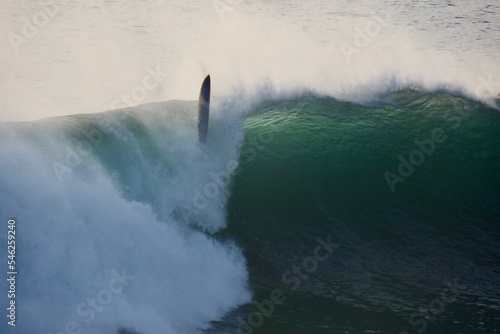 wipeout on big wave for surfer