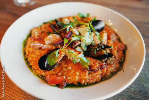 Italian risotto with seafood in restaurant.