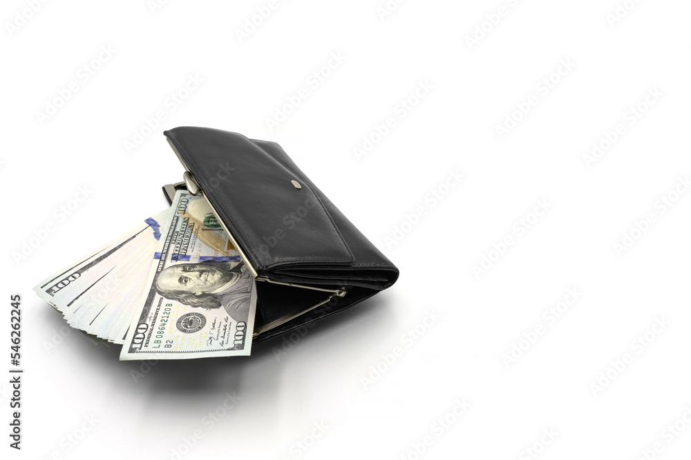 Cash from one hundred dollar bills in a wallet on a white background. A lot of US dollars in a black wallet. Cash from one hundred dollar bills in a wallet on a white background. A lot of US dollars in a black wallet.