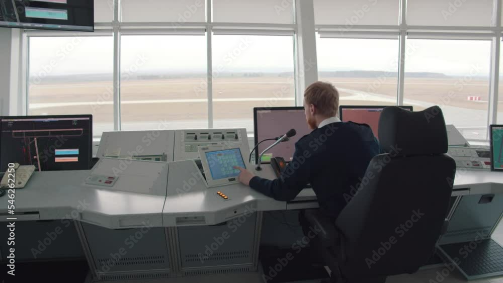 Male Air Traffic Controller Talk using microphone in Airport Tower. Realtime Male Air Traffic Controller Talk using microphone in Airport Tower. Realtime