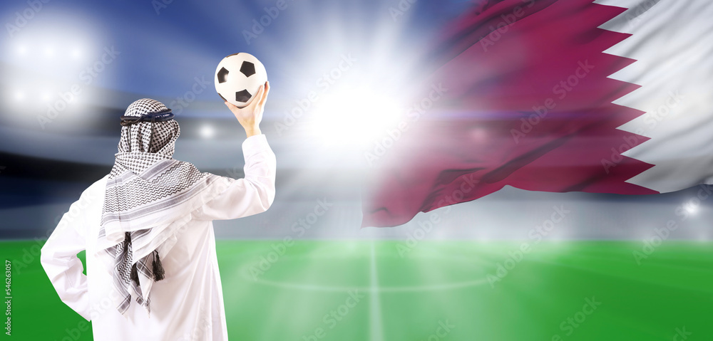 Arab man with ball. The concept of football in Qatar.