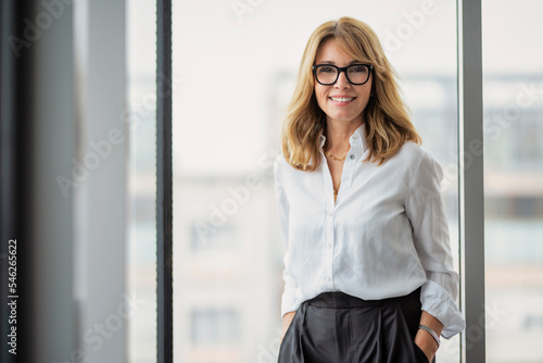 Portrait of smiling businesswoman in office photo