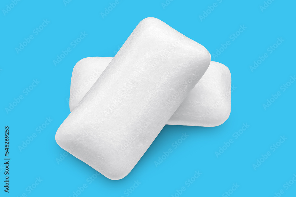 Three pieces of white chewing gum isolated on white. The whole subject is in focus. Three pieces of white chewing gum isolated on white. The whole subject is in focus.