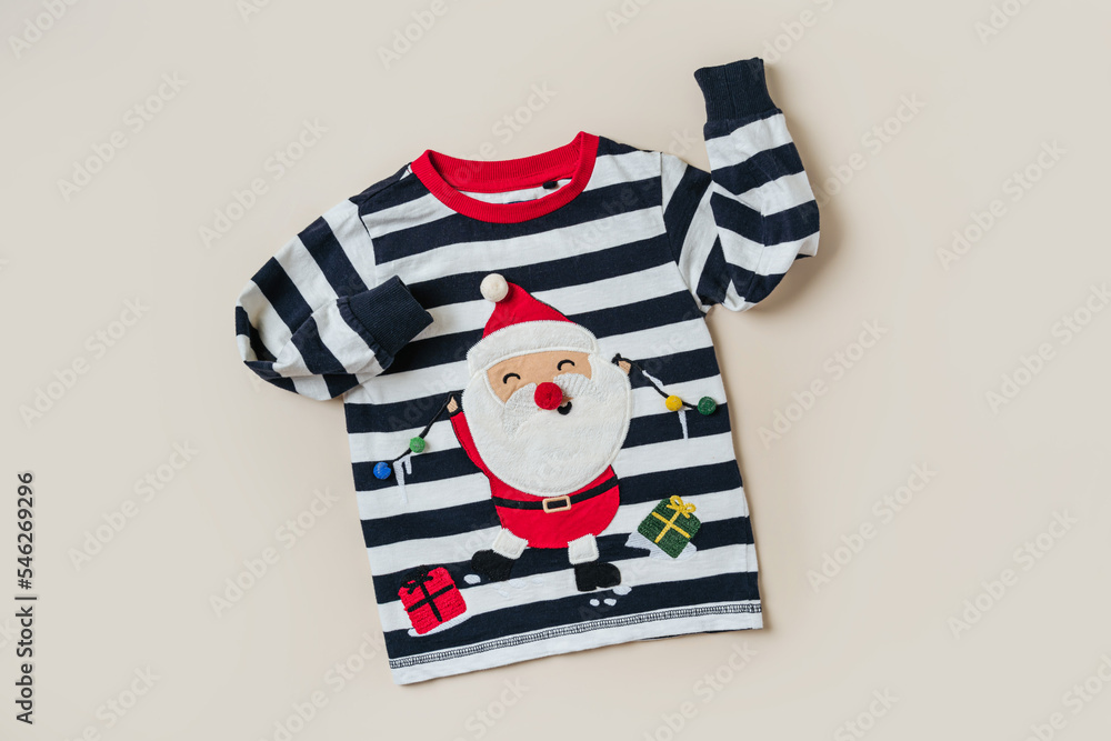 Childrens jumper with Santa Claus. Kids clothes and accessories for Christmas party. Fashion baby clothes. - obrazy, fototapety, plakaty 