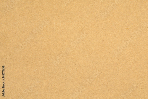 Seamless texture of durable cardboard, detailed surface of yellow recycled cardboard