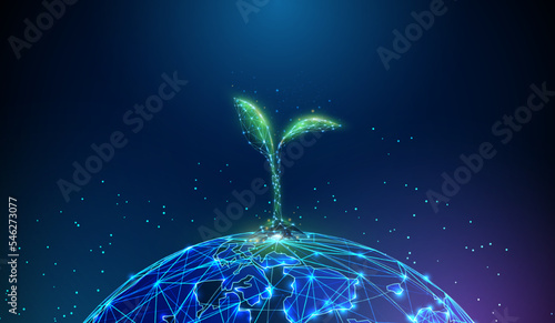 Abstract blue planet Earth with green plant sprout over it photo