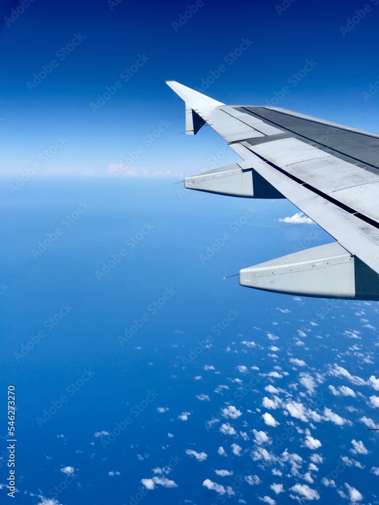 Aerial View of Blue Sky and Clouds from Airplane Aerial View of Blue Sky and Clouds from Airplane