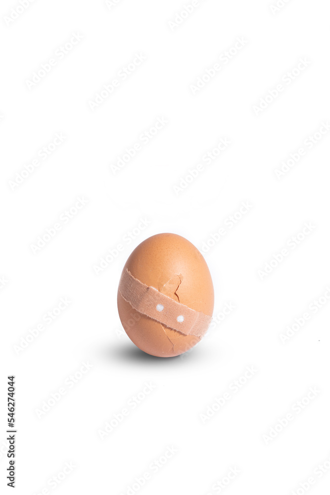 Creative medicine and healthcare concept, sticking plaster on cracked broken egg. Creative medicine and healthcare concept, sticking plaster on cracked broken egg.