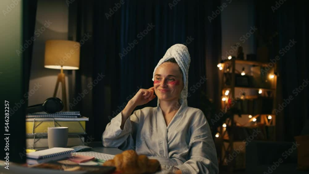 Happy businesswoman watching computer closeup. Home look girl working late night Happy businesswoman watching computer closeup. Home look girl working late night