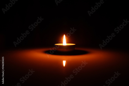 candle giving light orange close-up Blurred or blurry, dark background