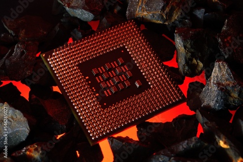 The microprocessor from the computer lies on hot coals. Close-up photo