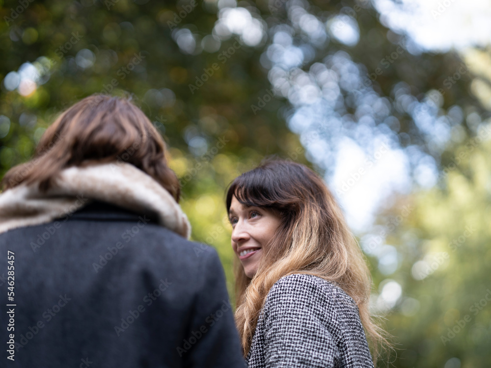 Fototapeta premium Women looking at each other in park