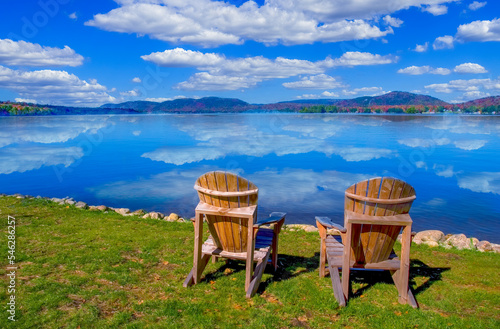 Two chairs on Fourth Lake ( Fulton Chain Lakes ) in the Adirondack Mounations of New York State photo
