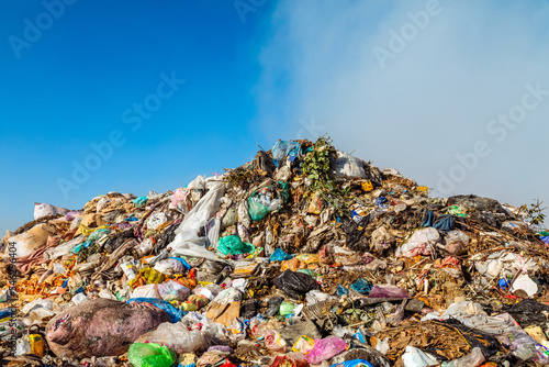 Closeup of burning trash piles in landfill